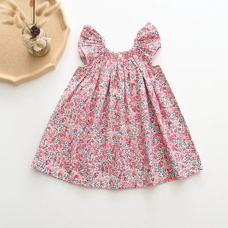 Smocked, Pretty Print European Style Dresses. Summer Cotton/Linen Dresses with Fly-Away Sleeves. Great Everyday Dresses as well as perfect for Birthday parties and many occasions.