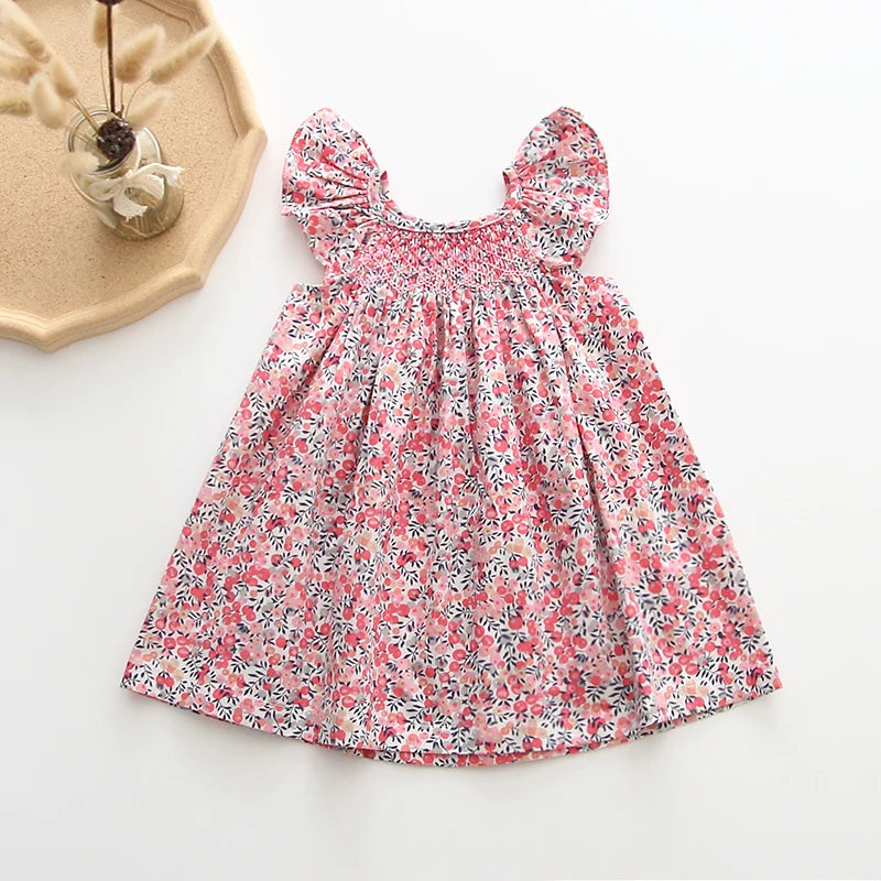 Smocked, Pretty Print European Style Dresses. Summer Cotton/Linen Dresses with Fly-Away Sleeves. Great Everyday Dresses as well as perfect for Birthday parties and many occasions.