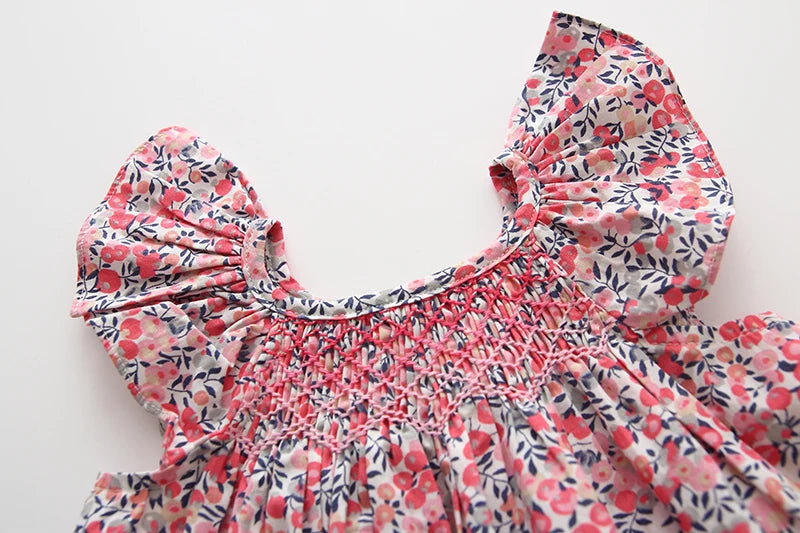 Smocked, Pretty Print European Style Dresses. Summer Cotton/Linen Dresses with Fly-Away Sleeves. Great Everyday Dresses as well as perfect for Birthday parties and many occasions.