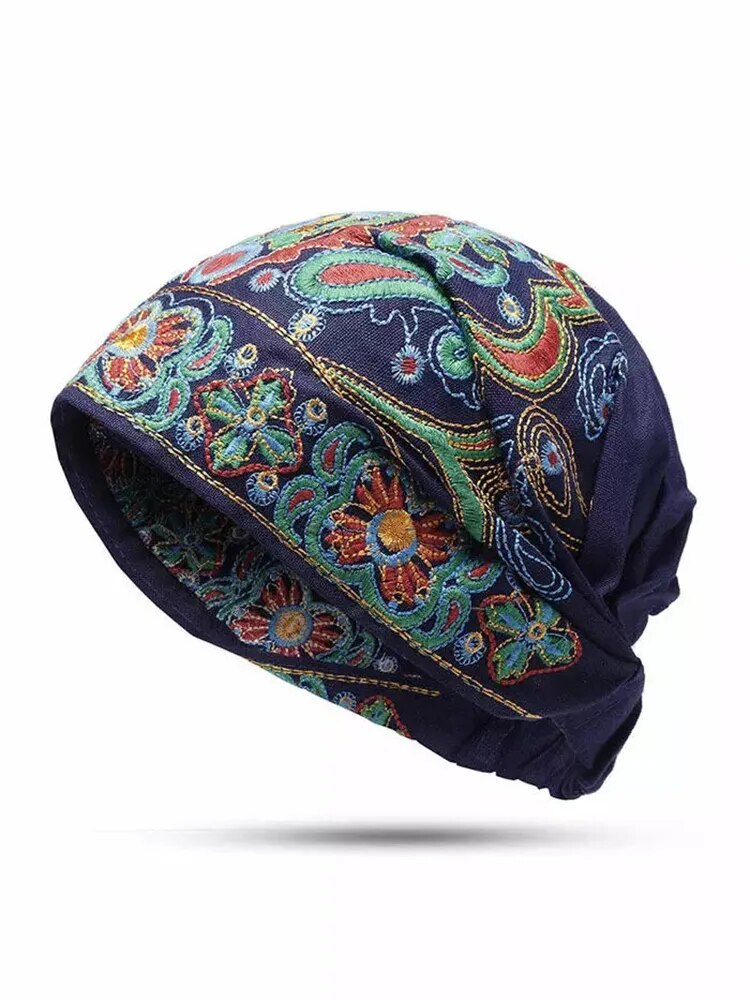 Felt Cap adorned with vintage designs in bold, colorful embroidery. Keep warm and stylish!