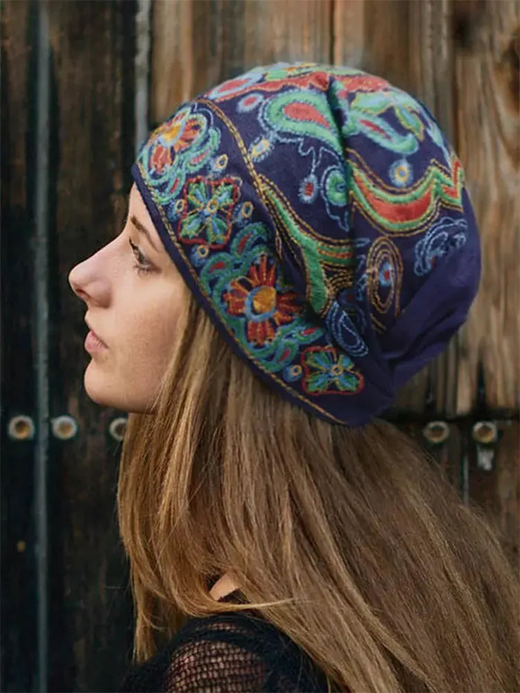 Felt Cap adorned with vintage designs in bold, colorful embroidery. Keep warm and stylish!