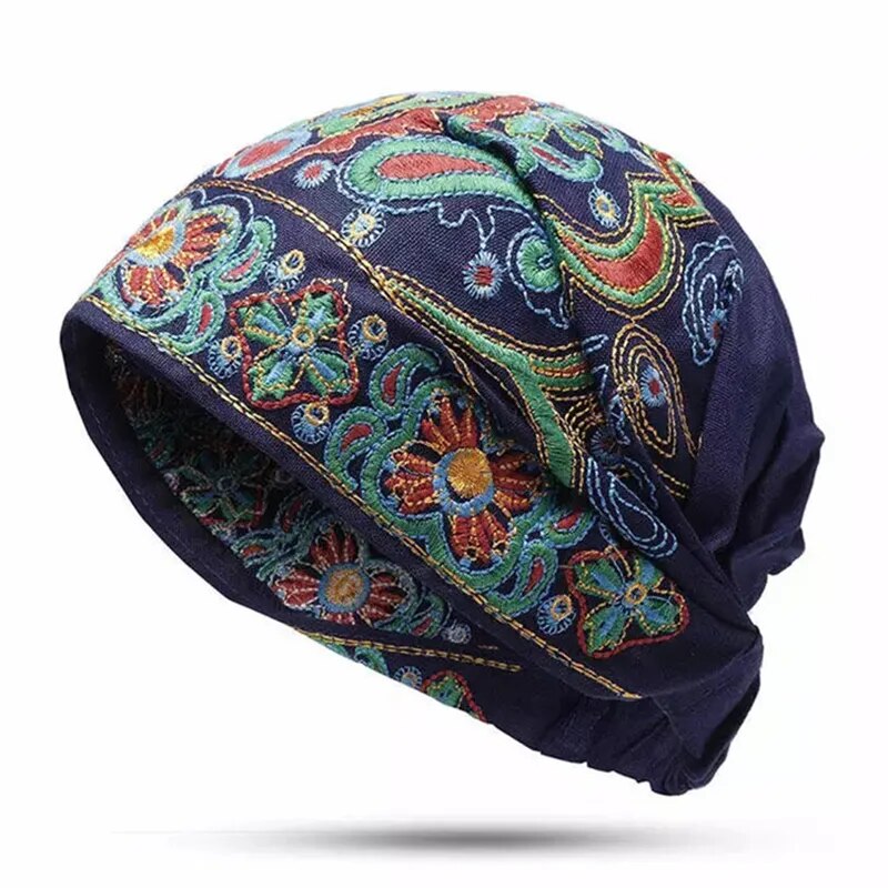 Felt Cap adorned with vintage designs in bold, colorful embroidery. Keep warm and stylish!