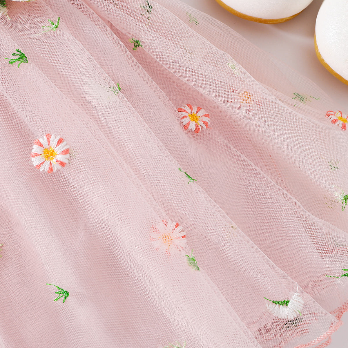 The perfect Sweet Spring Dress for a budding ballerina or fairy. Complete with flowers Embroidered at the waist and on the tulle skirt.. Perfect for Spring and Summer events!