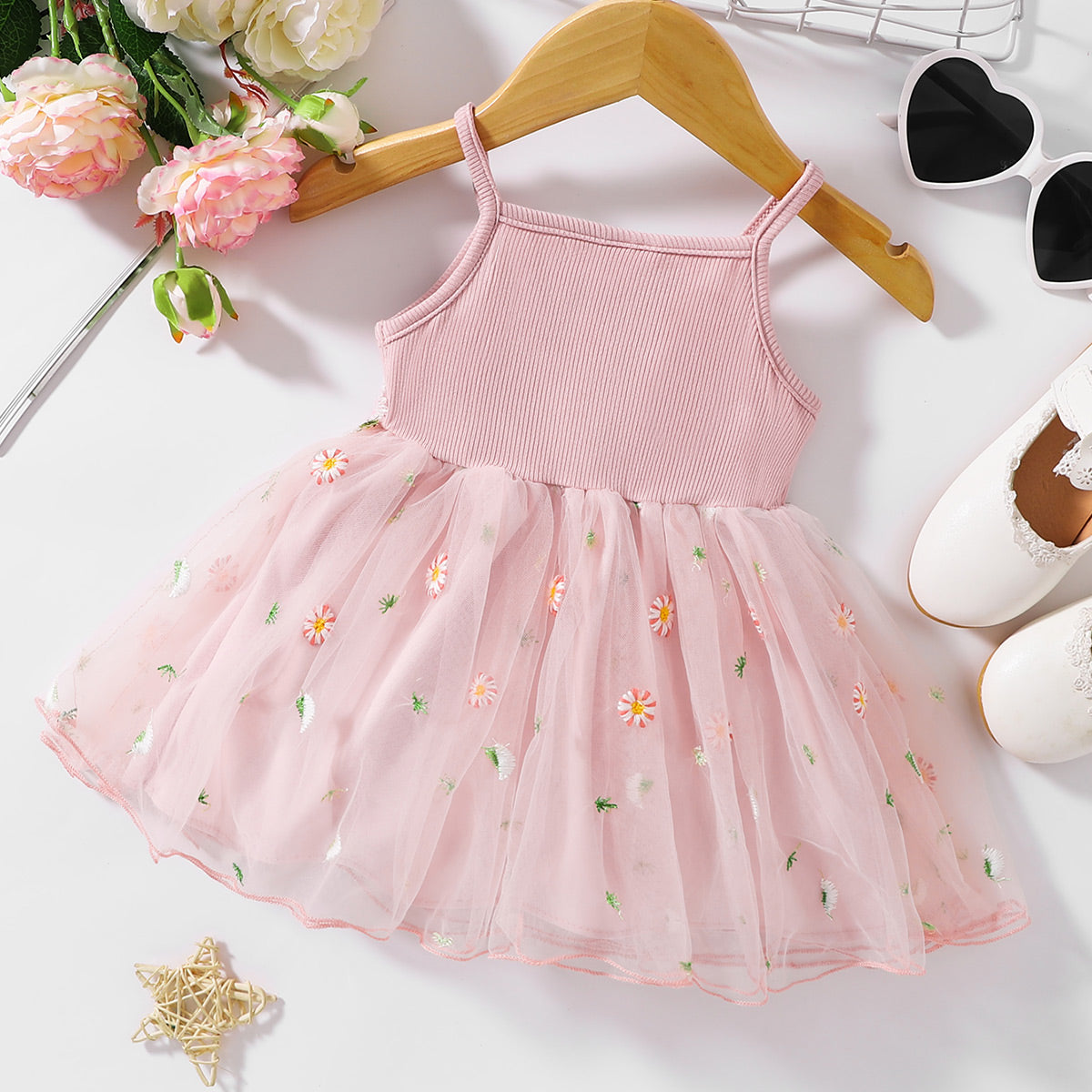 The perfect Sweet Spring Dress for a budding ballerina or fairy. Complete with flowers Embroidered at the waist and on the tulle skirt.. Perfect for Spring and Summer events!