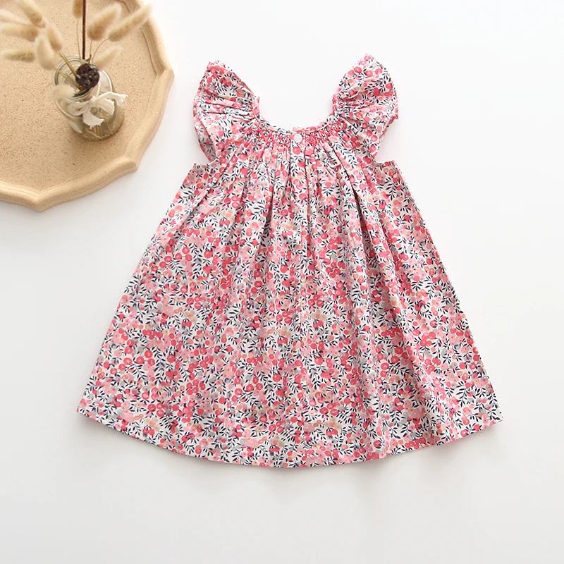 Smocked, Pretty Print European Style Dresses.  Summer Cotton/Linen Dresses with Fly-Away Sleeves. Great Everyday Dresses as well as perfect for Birthday parties and many occasions.