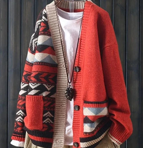 Cardigan in Red, Black and White with different designs on each side. Elements of zig zag and stripes. Three buttons closure and two pockets in front.