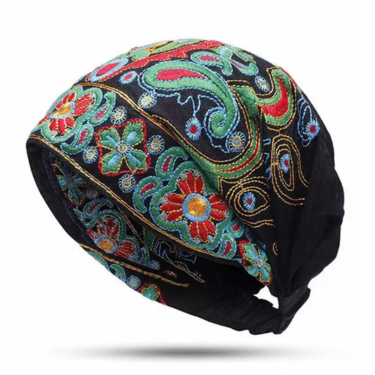 Felt Cap adorned with vintage designs in bold, colorful embroidery. Keep warm and stylish!