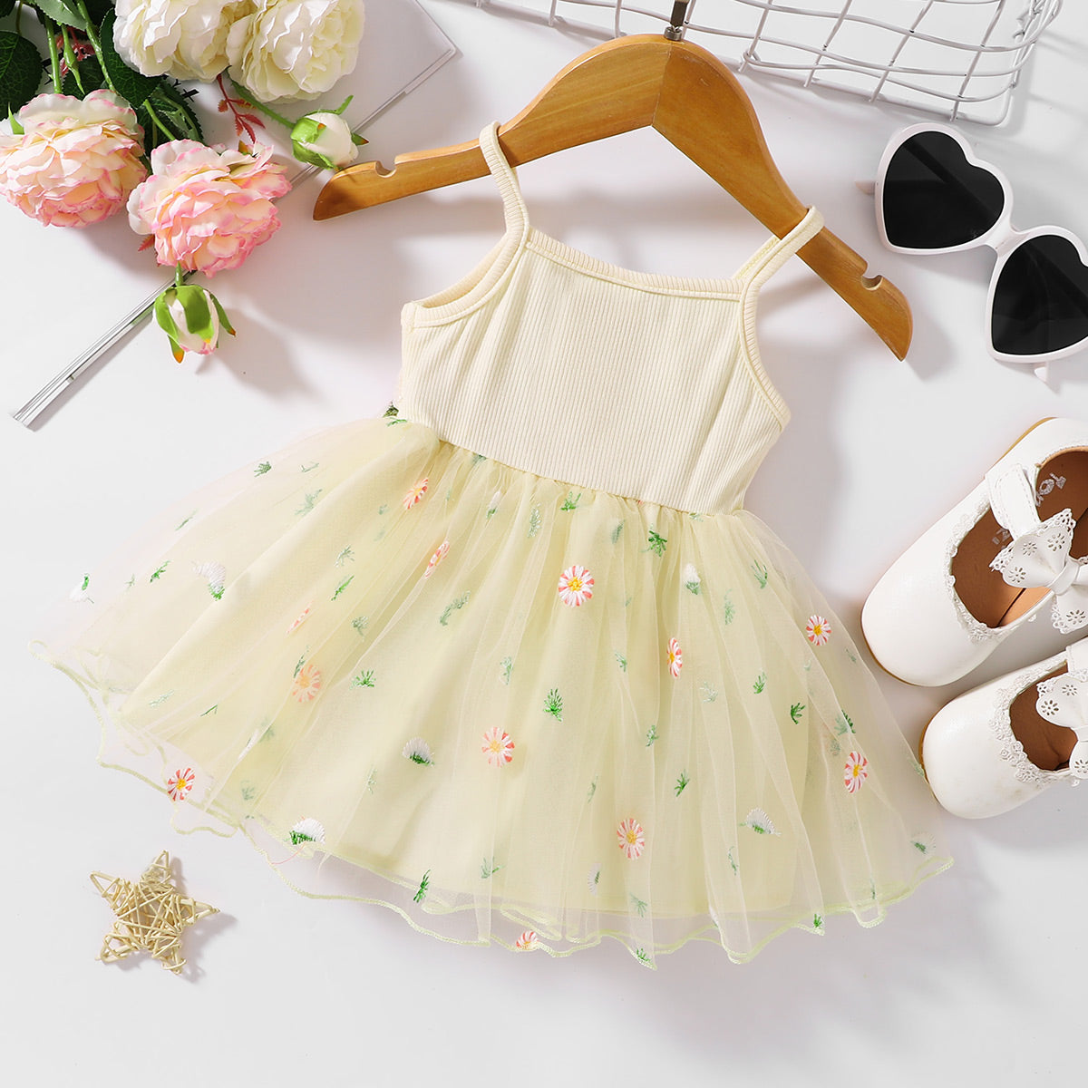 The perfect Sweet Spring Dress for a budding ballerina or fairy. Complete with flowers Embroidered at the waist and on the tulle skirt.. Perfect for Spring and Summer events!