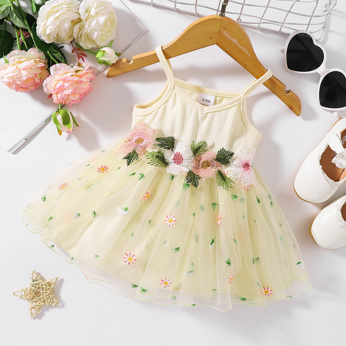 The perfect Sweet Spring Dress for a budding ballerina or fairy. Complete with flowers Embroidered at the waist and on the tulle skirt.. Perfect for Spring and Summer events!