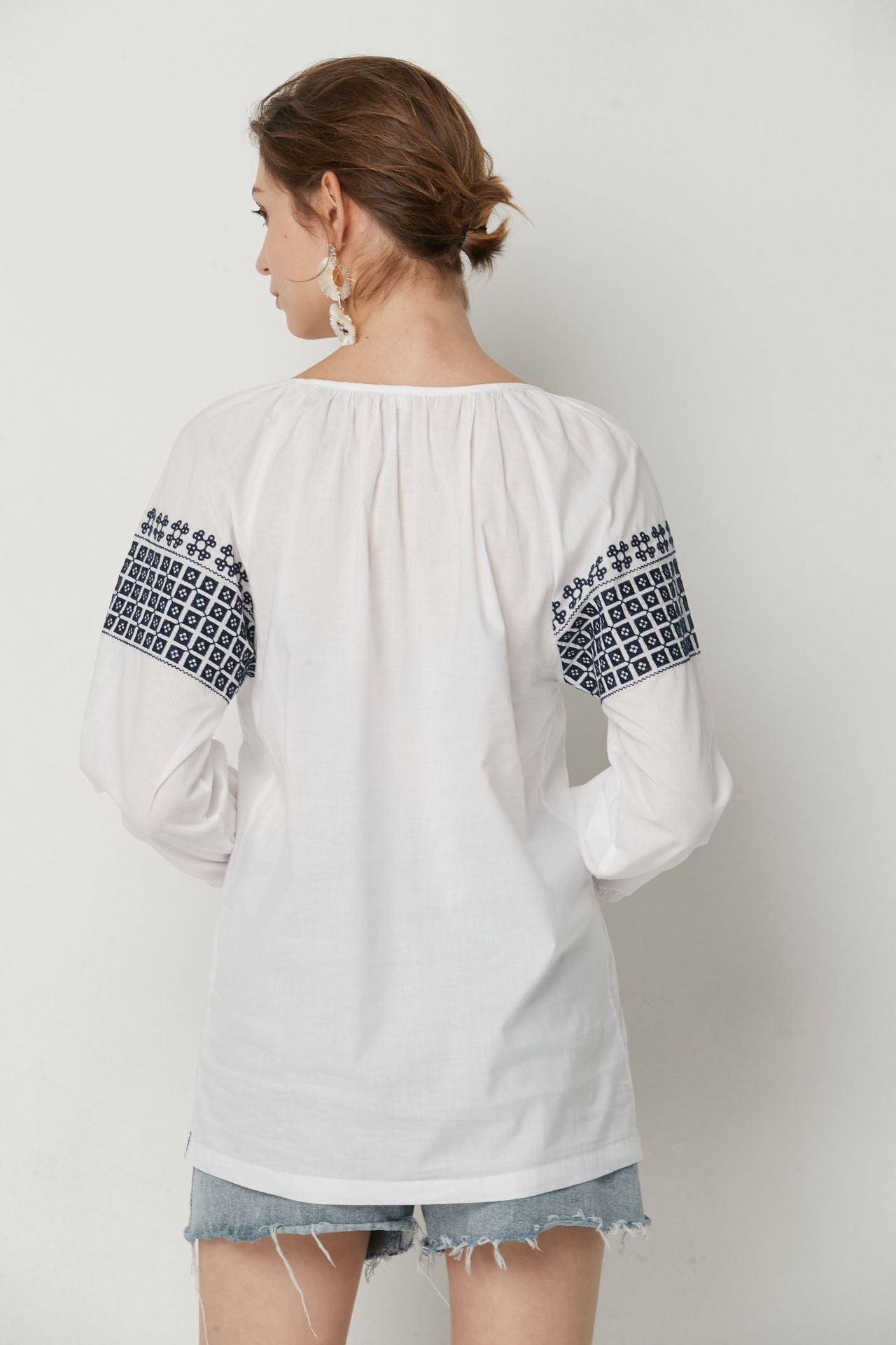 White Bohemia top with Blue cotton embroidery.