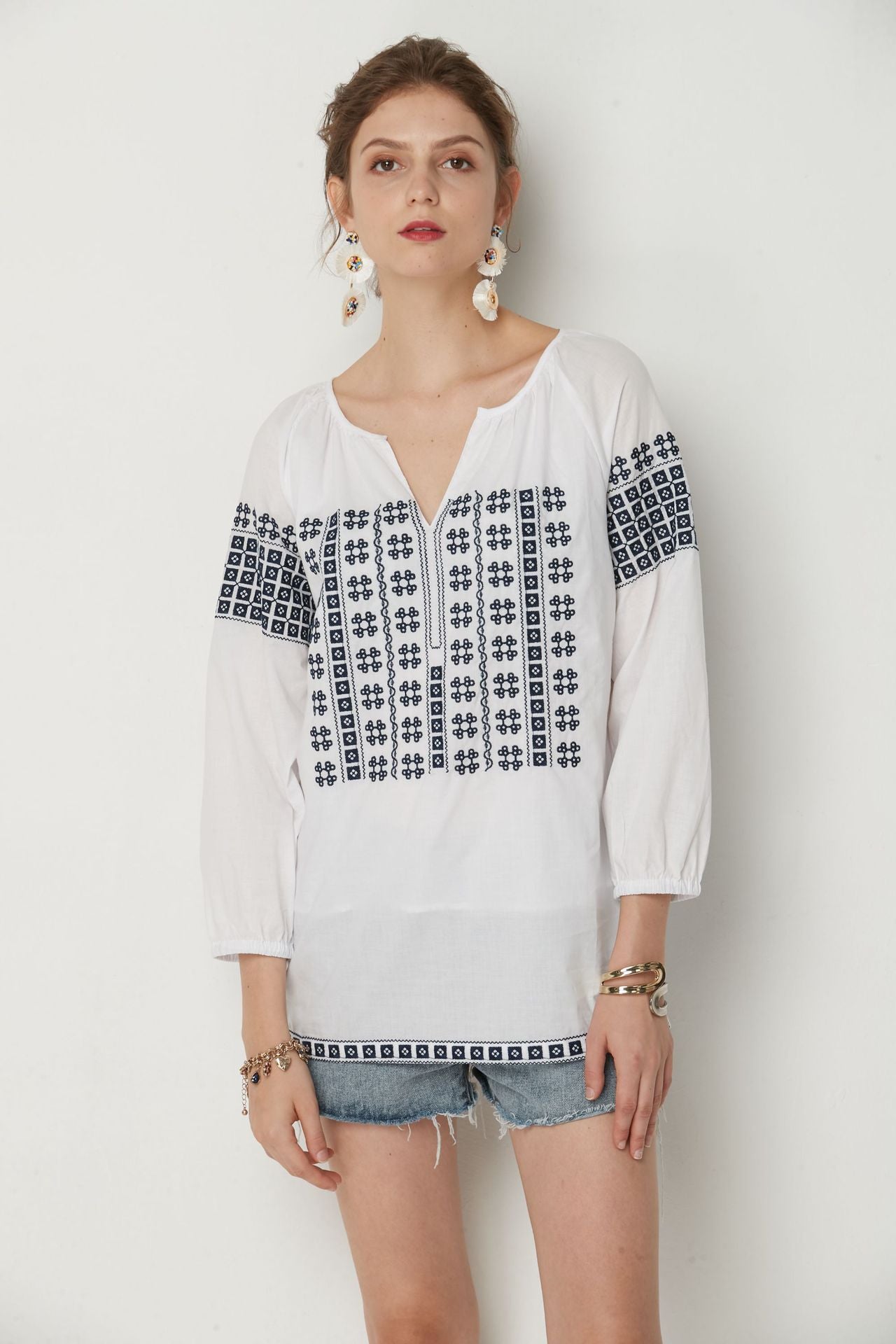 White Bohemia top with Blue cotton embroidery.