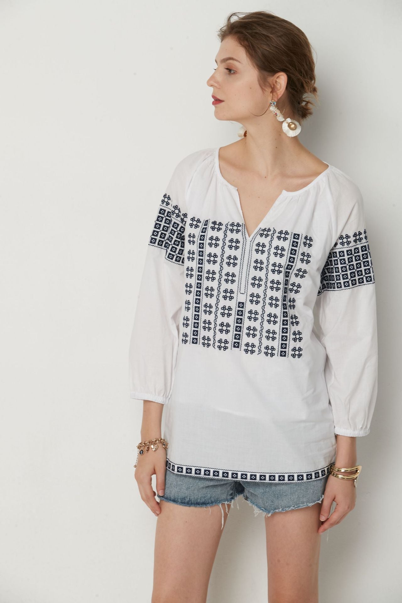 White Bohemia top with Blue cotton embroidery.