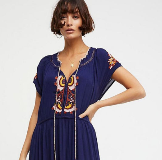 Great looking Maxi Dress with Lace Up Tassel neckline and Elegant Embroidery. Comes in Paprika, Indigo and Snow!