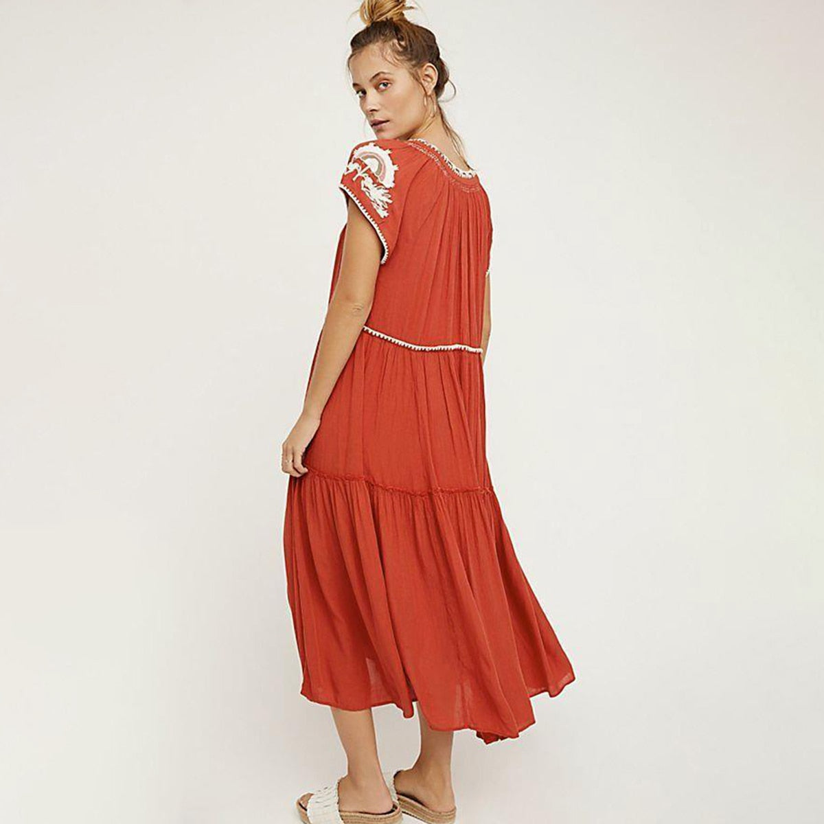 Great looking Maxi Dress with Lace Up Tassel neckline and Elegant Embroidery. Comes in Paprika, Indigo and Snow!