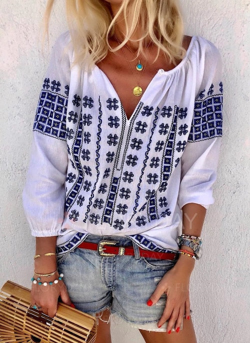 White Bohemia top with Blue cotton embroidery.