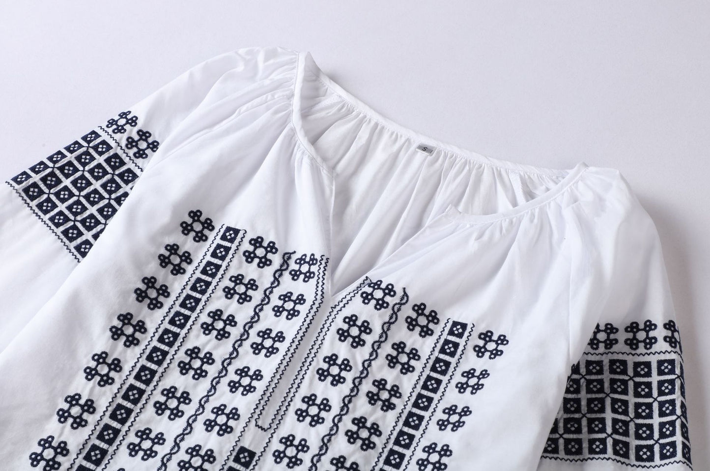 White Bohemia top with Blue cotton embroidery.