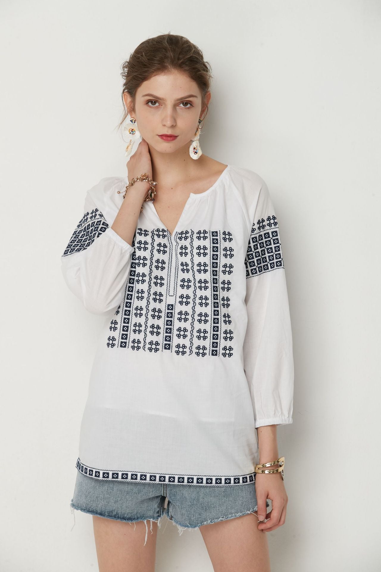 White Bohemia top with Blue cotton embroidery.