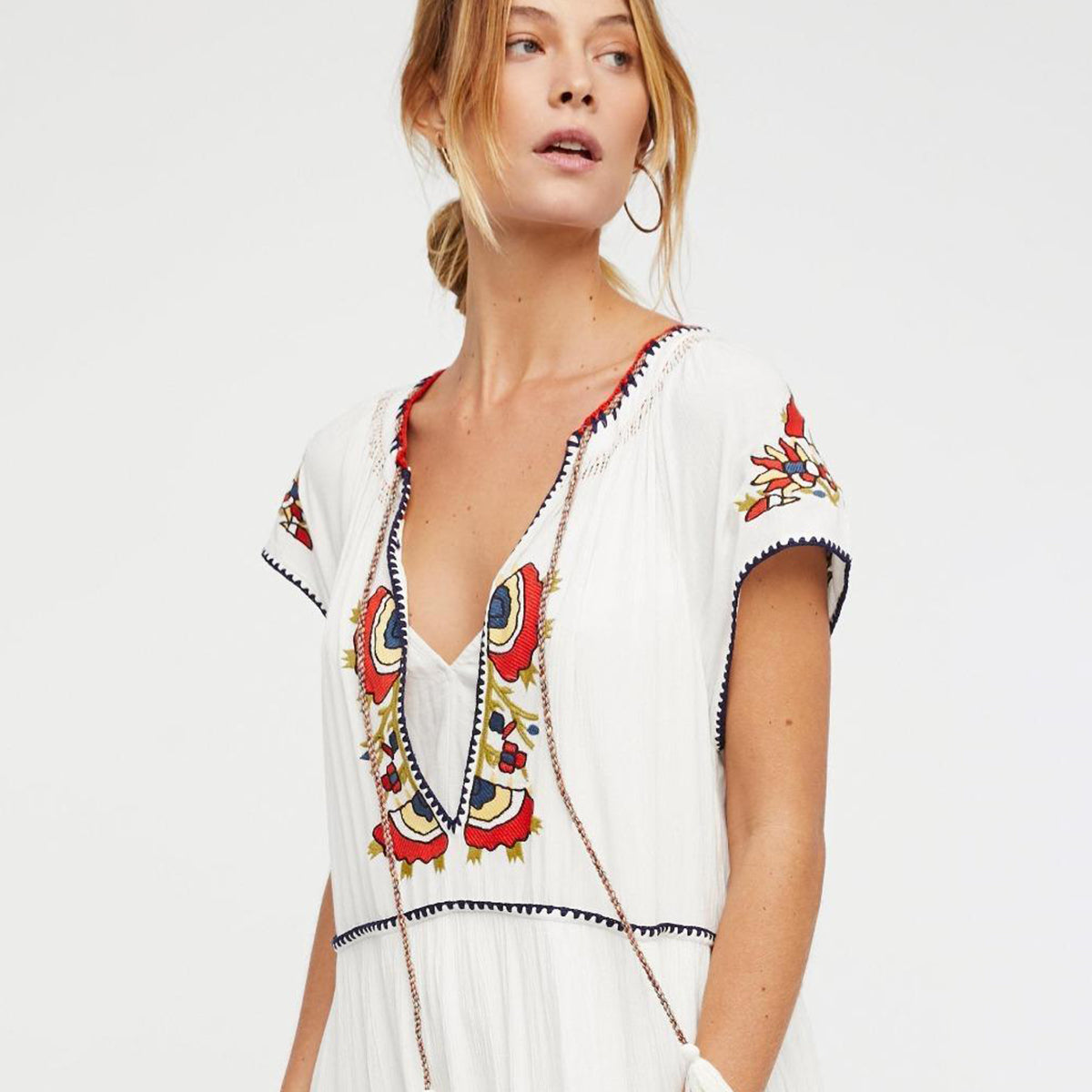 Great looking Maxi Dress with Lace Up Tassel neckline and Elegant Embroidery. Comes in Paprika, Indigo and Snow!