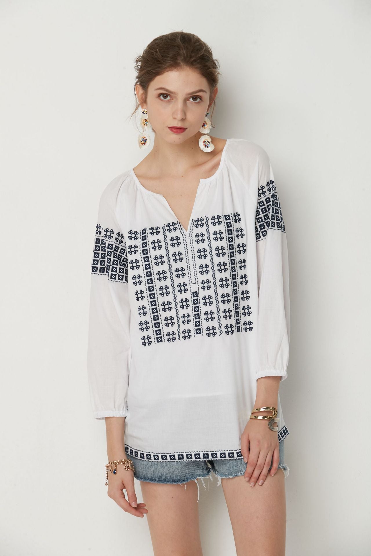 White Bohemia top with Blue cotton embroidery.