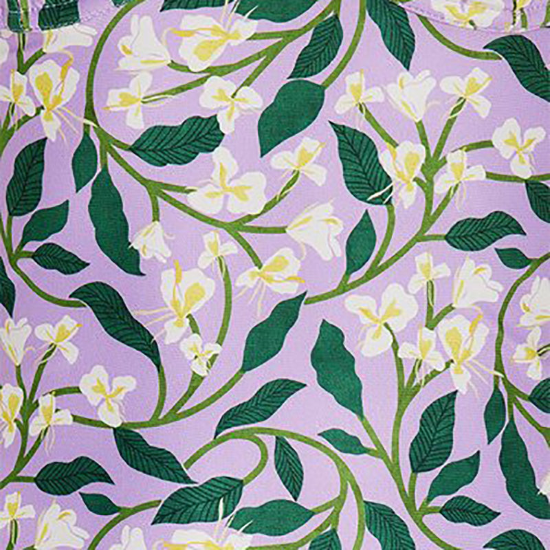 Purple background, overlay of White Honeysuckle Vines Print on One Piece Bathing Suit. Matching Wrap Skirt Cover-up available seperatly.