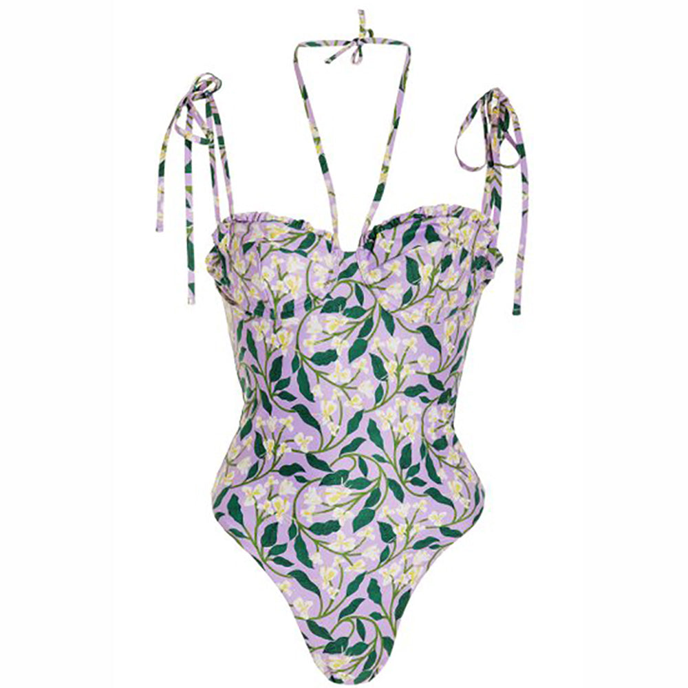 Purple background, overlay of White Honeysuckle Vines Print on One Piece Bathing Suit. Matching Wrap Skirt Cover-up available seperatly.